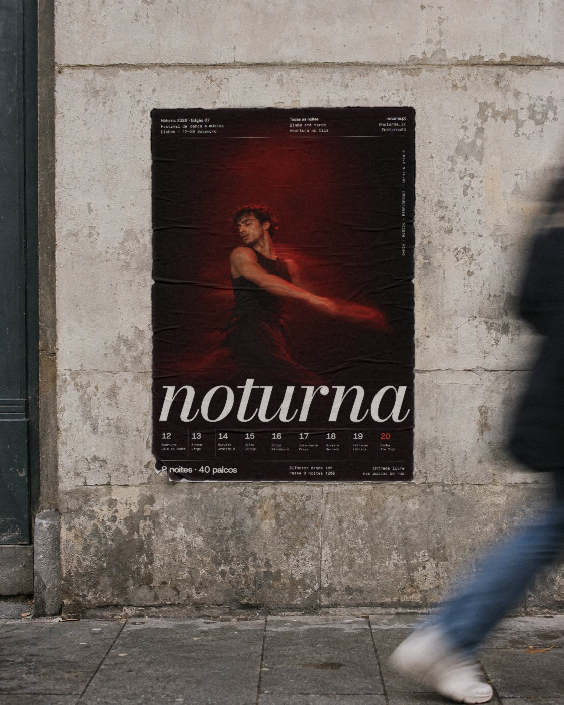 A Noturna poster pasted on a weathered Lisbon wall